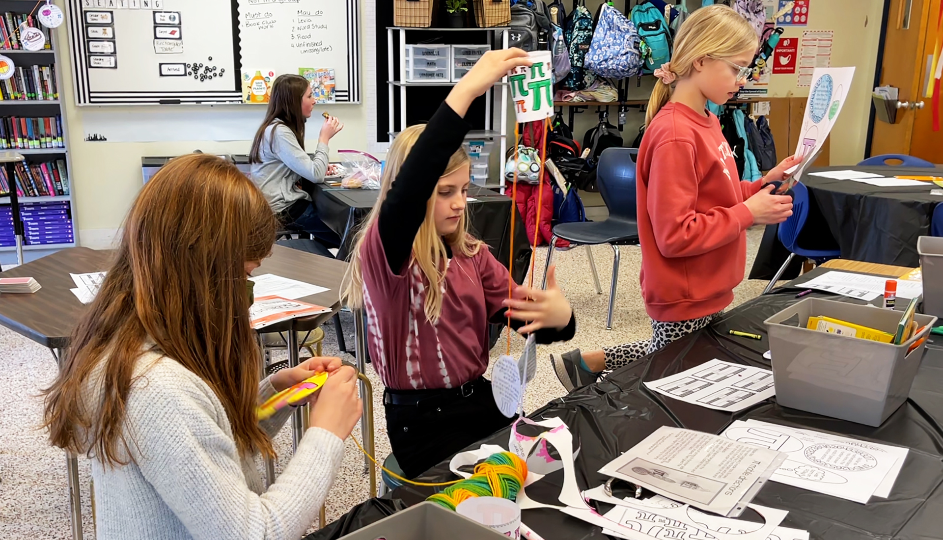 Three students working on a class project