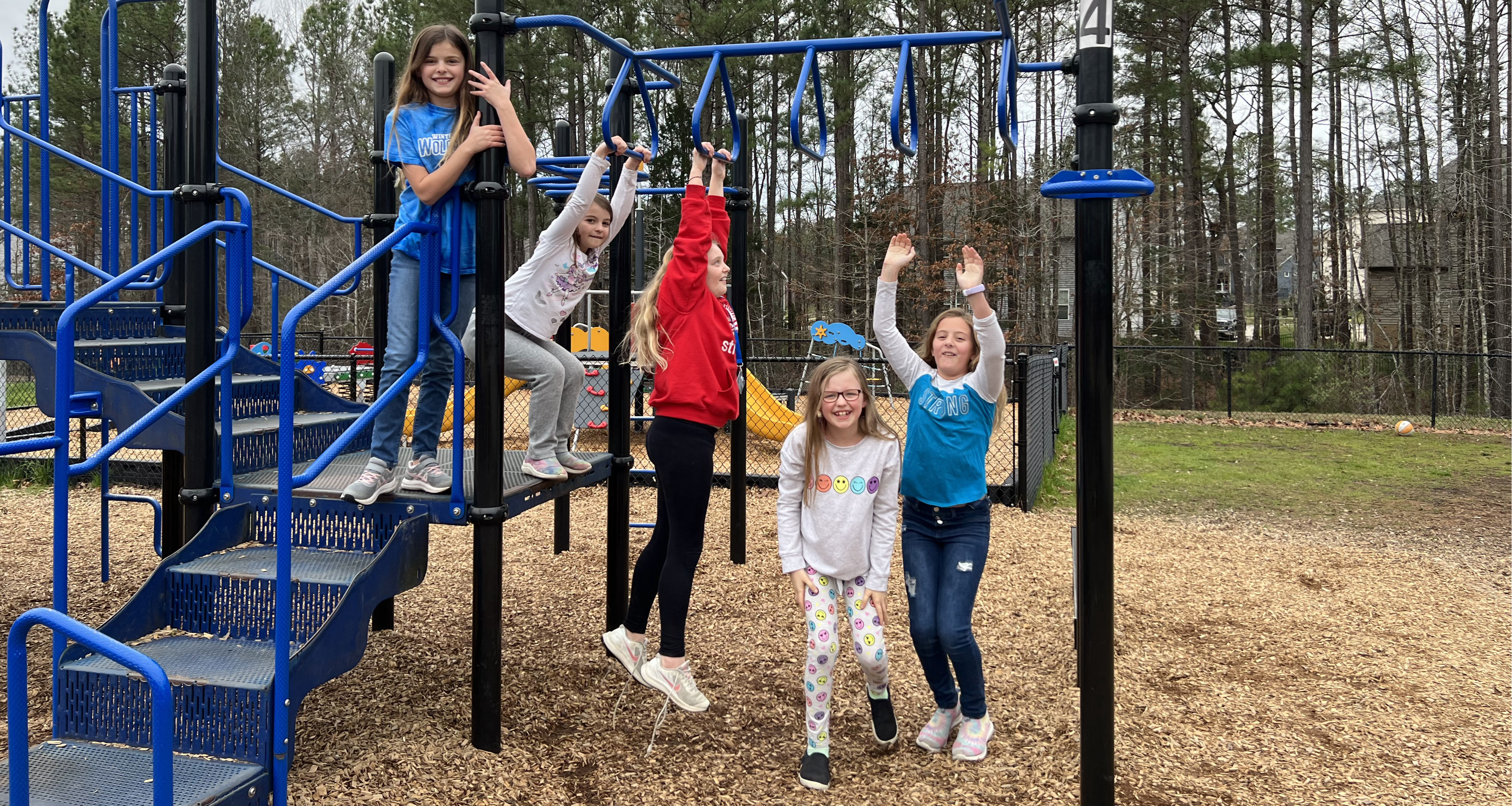 Students playing on the monkey bars