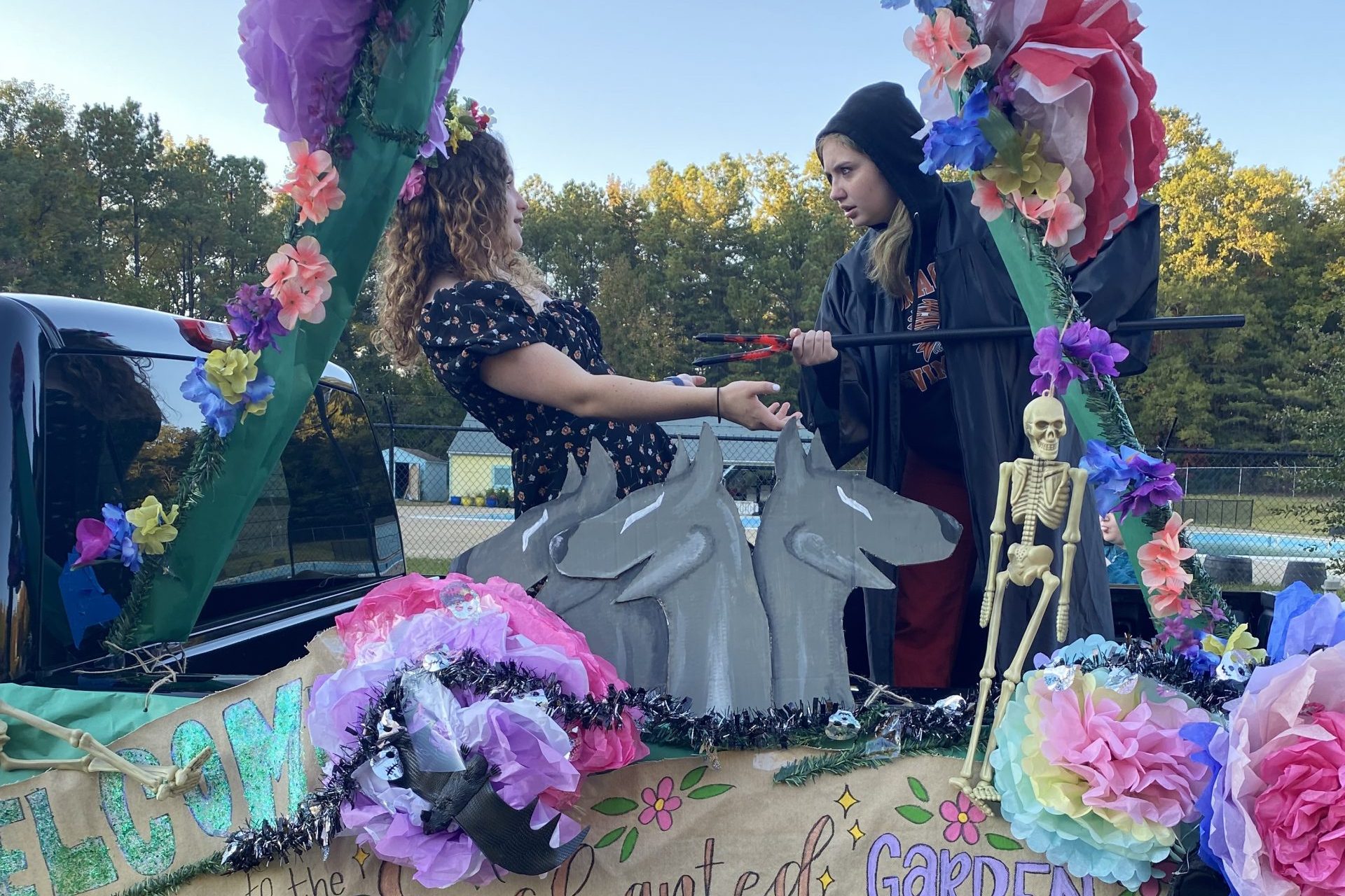 Two Latin Club members in the back of a pick-up truck during a celebration