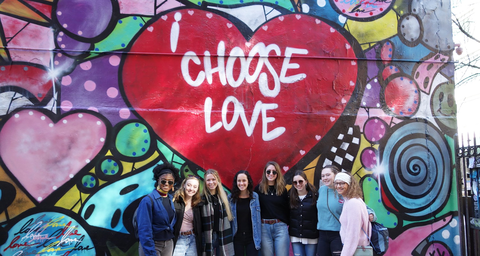 Several students pose for a selfie. 