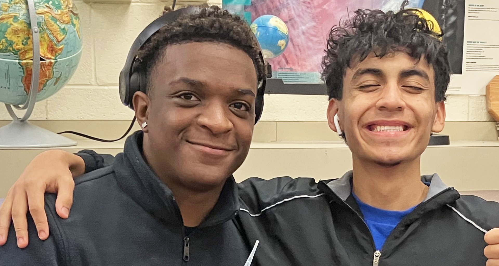 Two students pose for a photo