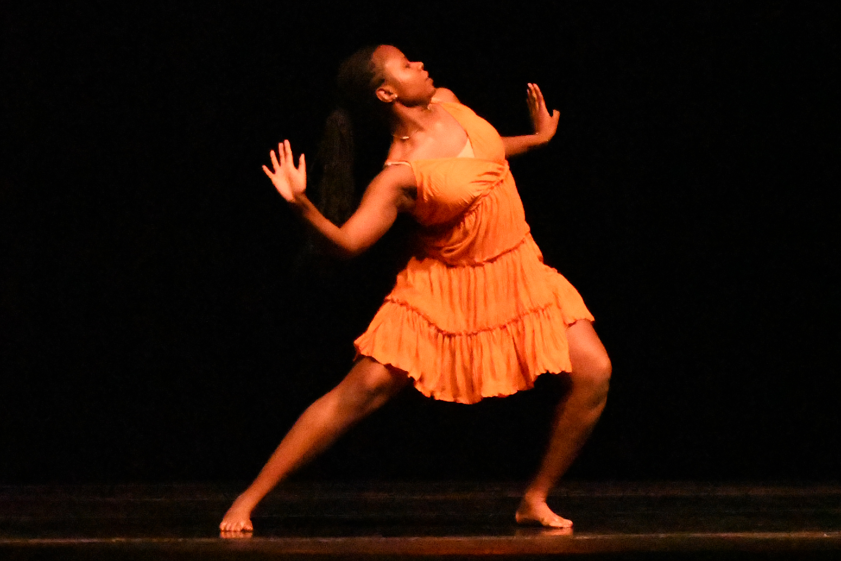 Student dancing on a stage