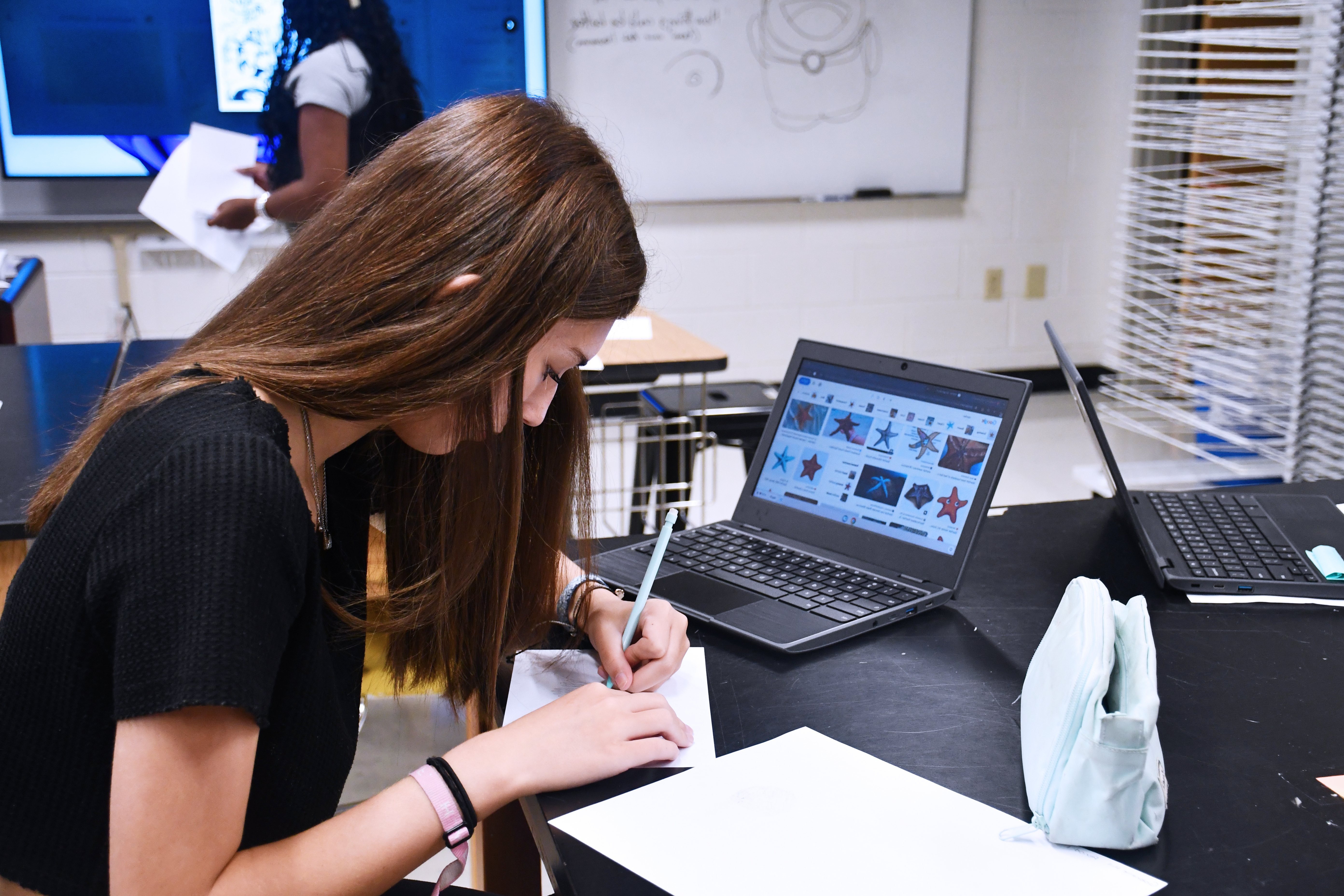 student working at her desk