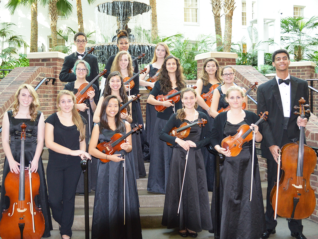 Group of students pose with instruments