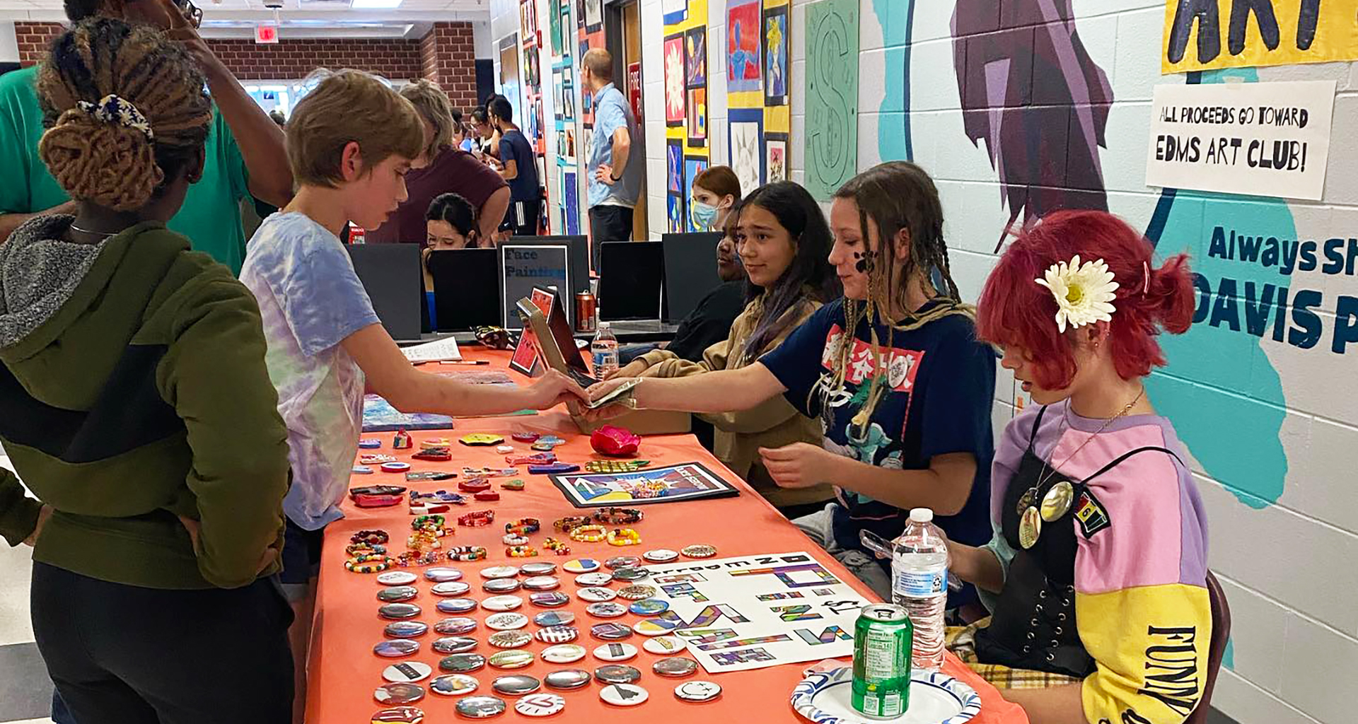 Students selling their crafts at the art fair