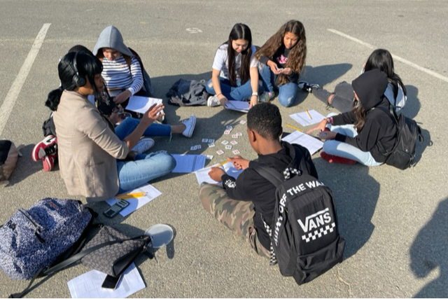 Students gathered together on the black top