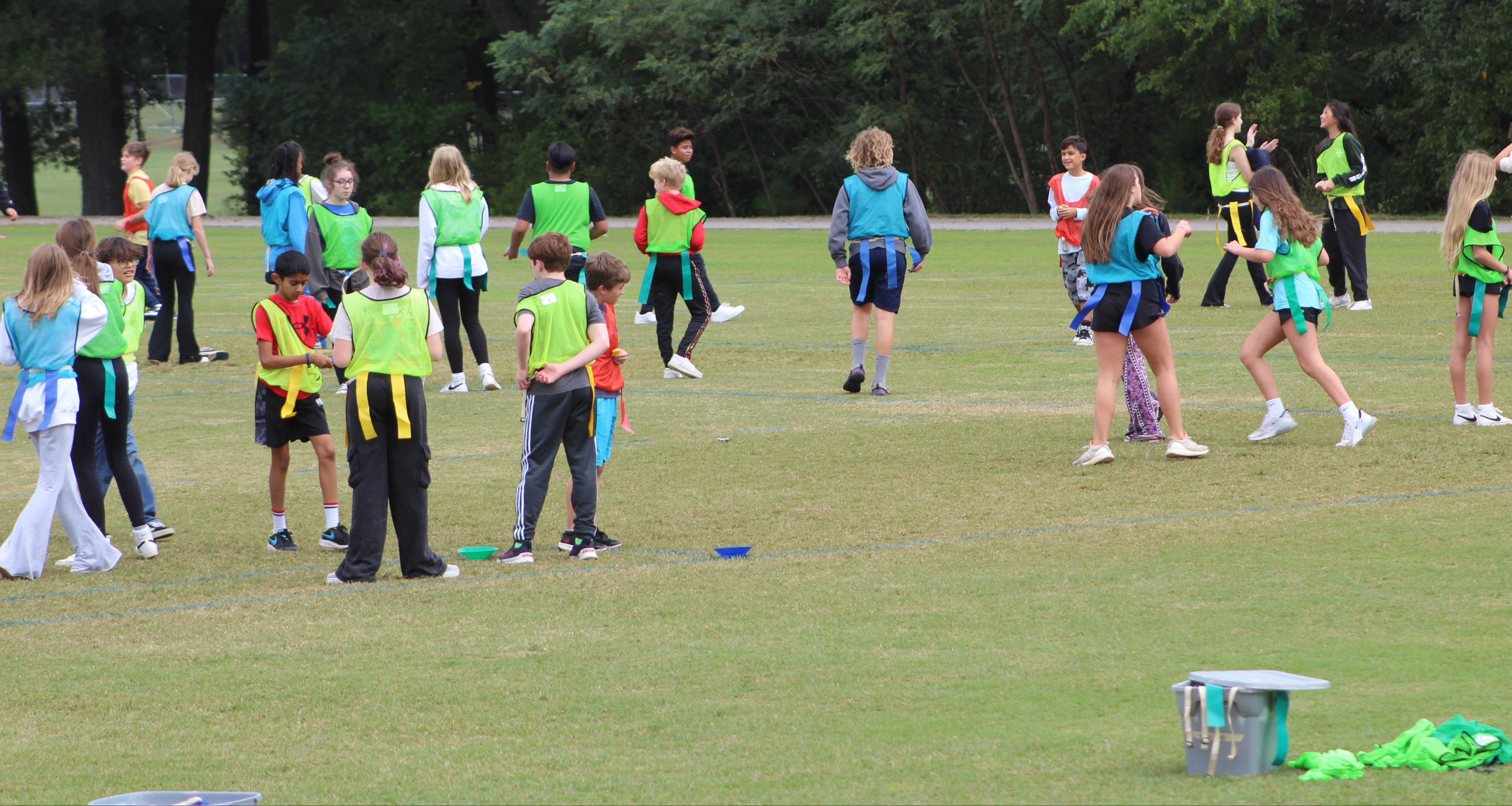 Students playing flag football on the school field