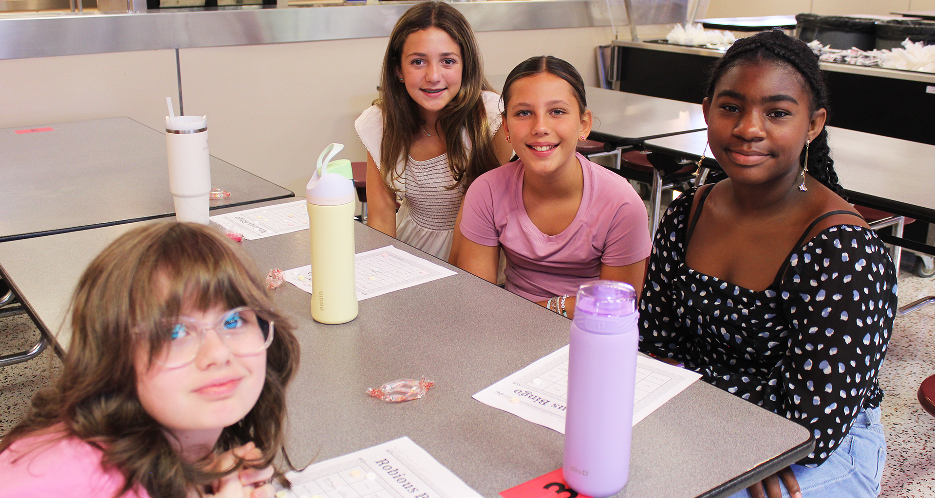 Four students pose for a photo