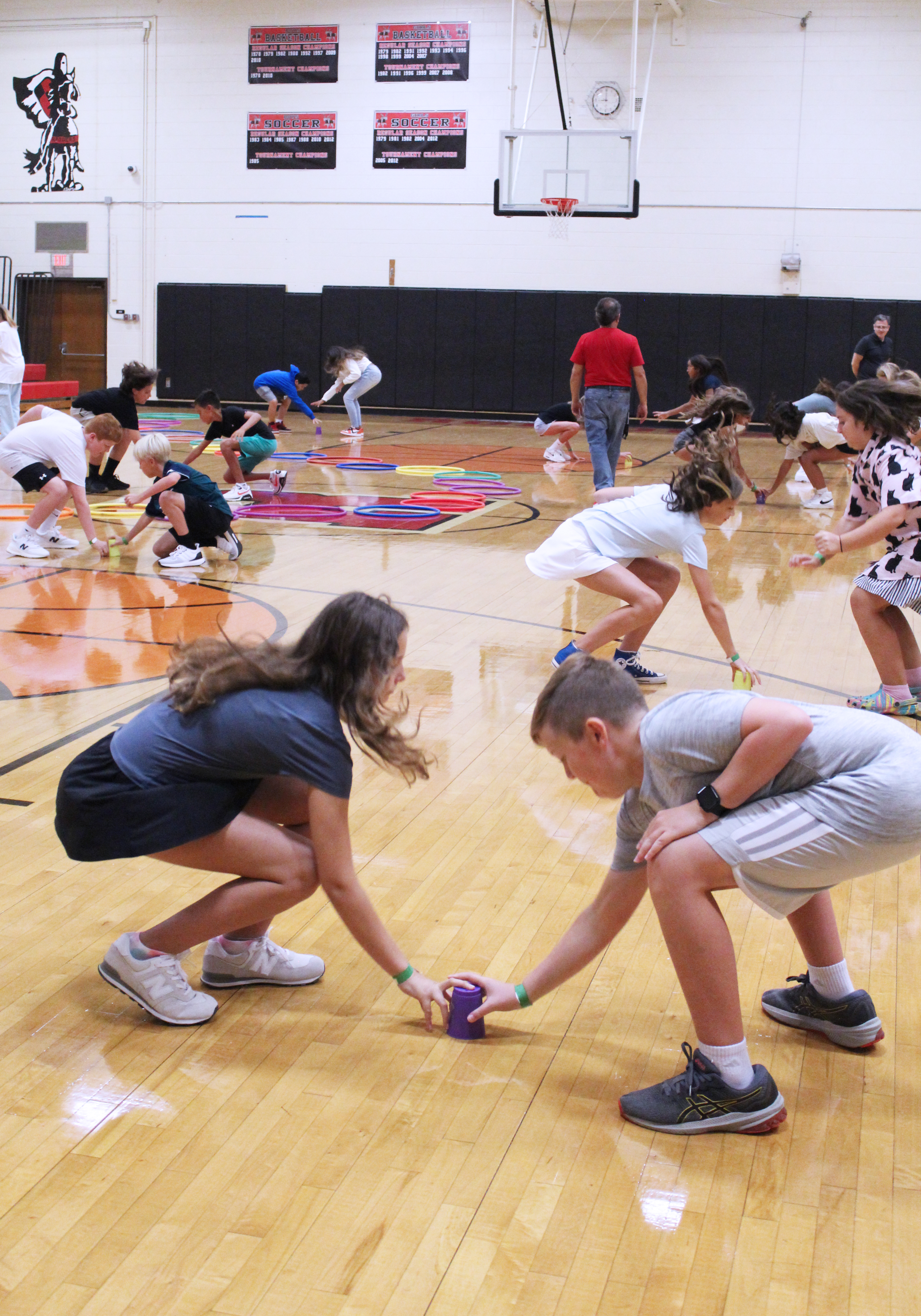 Students playing a game in the gym.