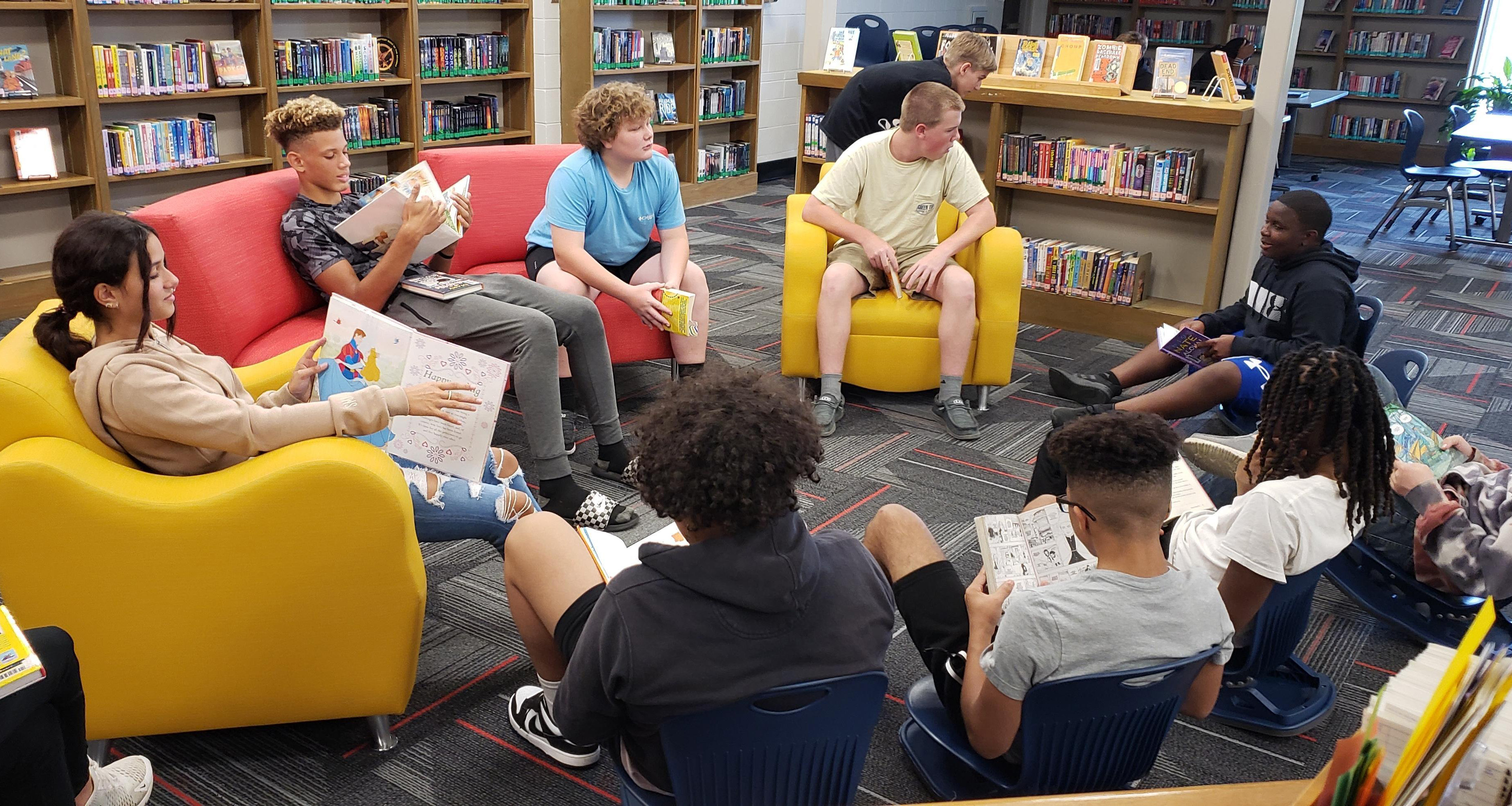 A group of students reading in the school library