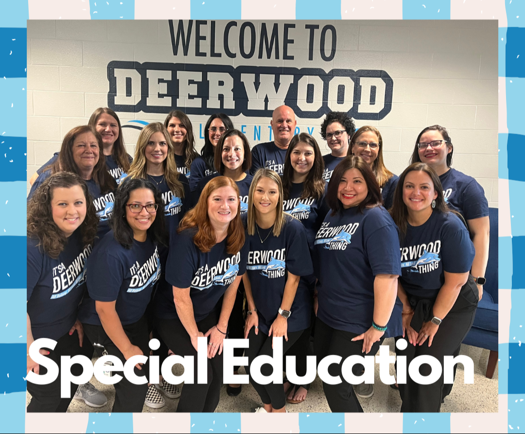 teachers with blue shirts in front of welcome sign