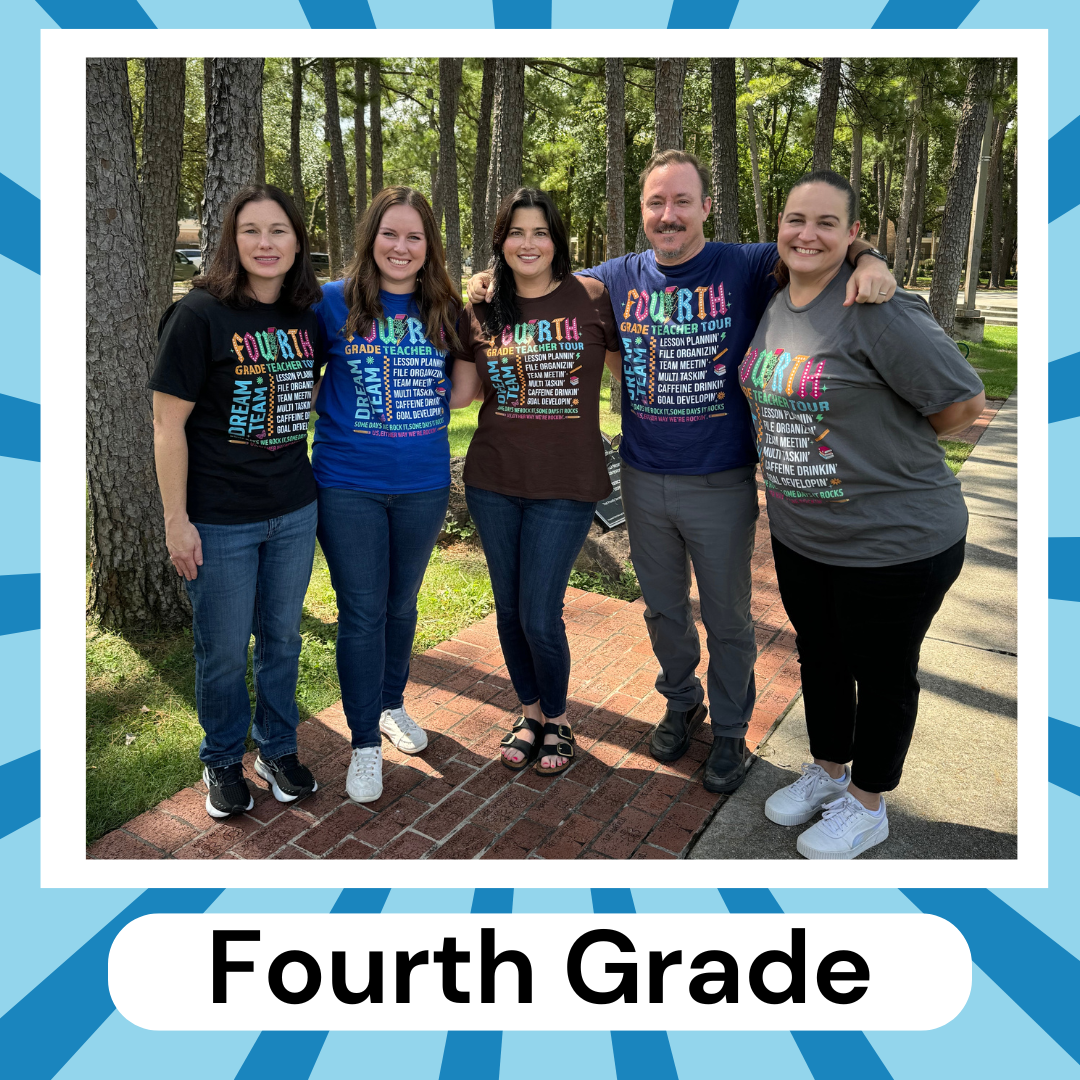 fourth grade teachers in blue shirts posing outside on playground equipment