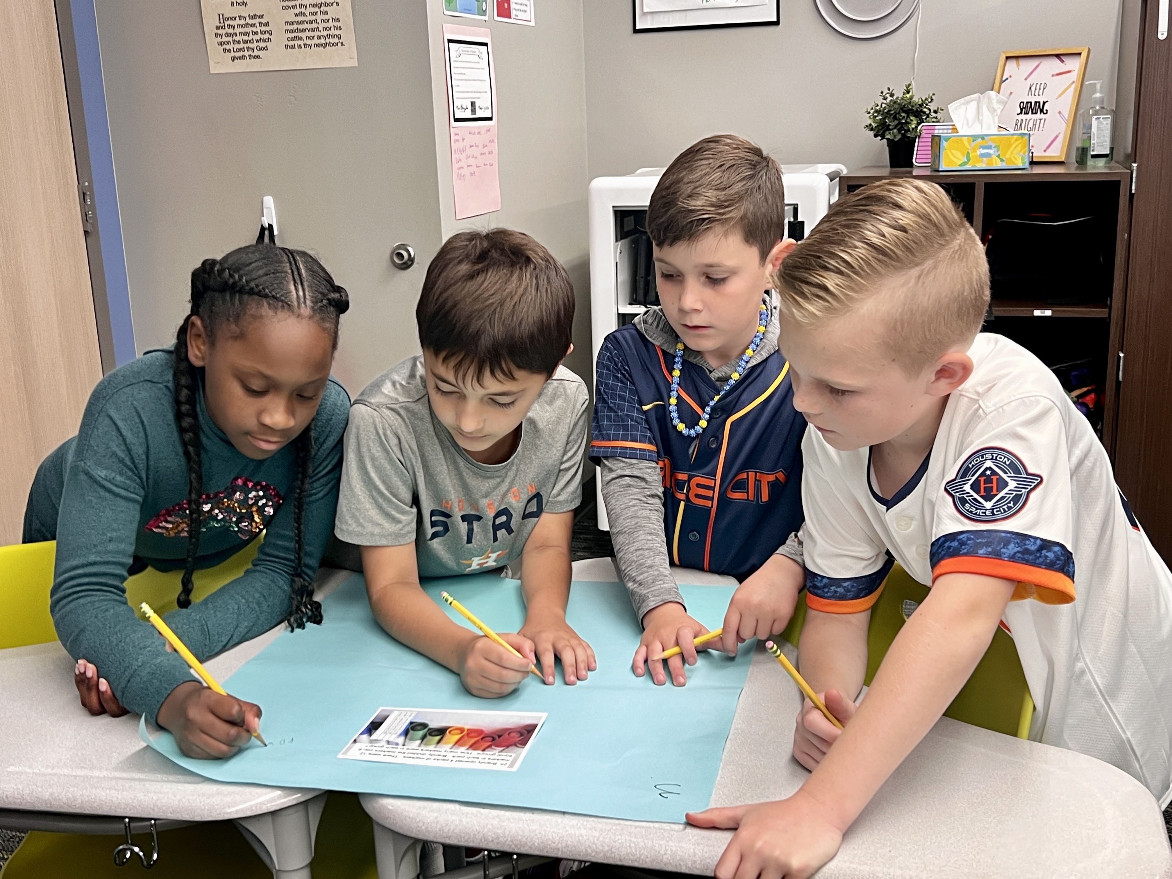 3rd graders collaborating on an assignment