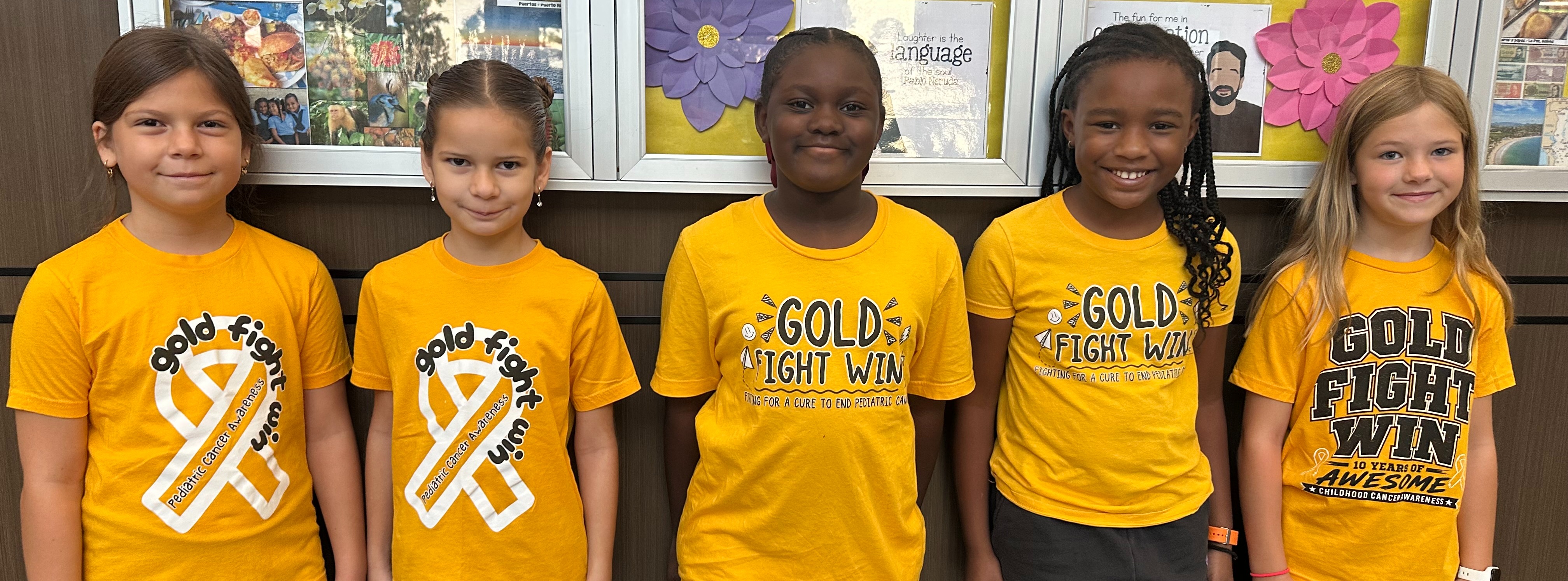 Students wearing Gold Fight Win shirts