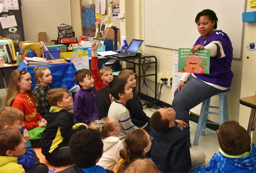 A teacher reading to her class