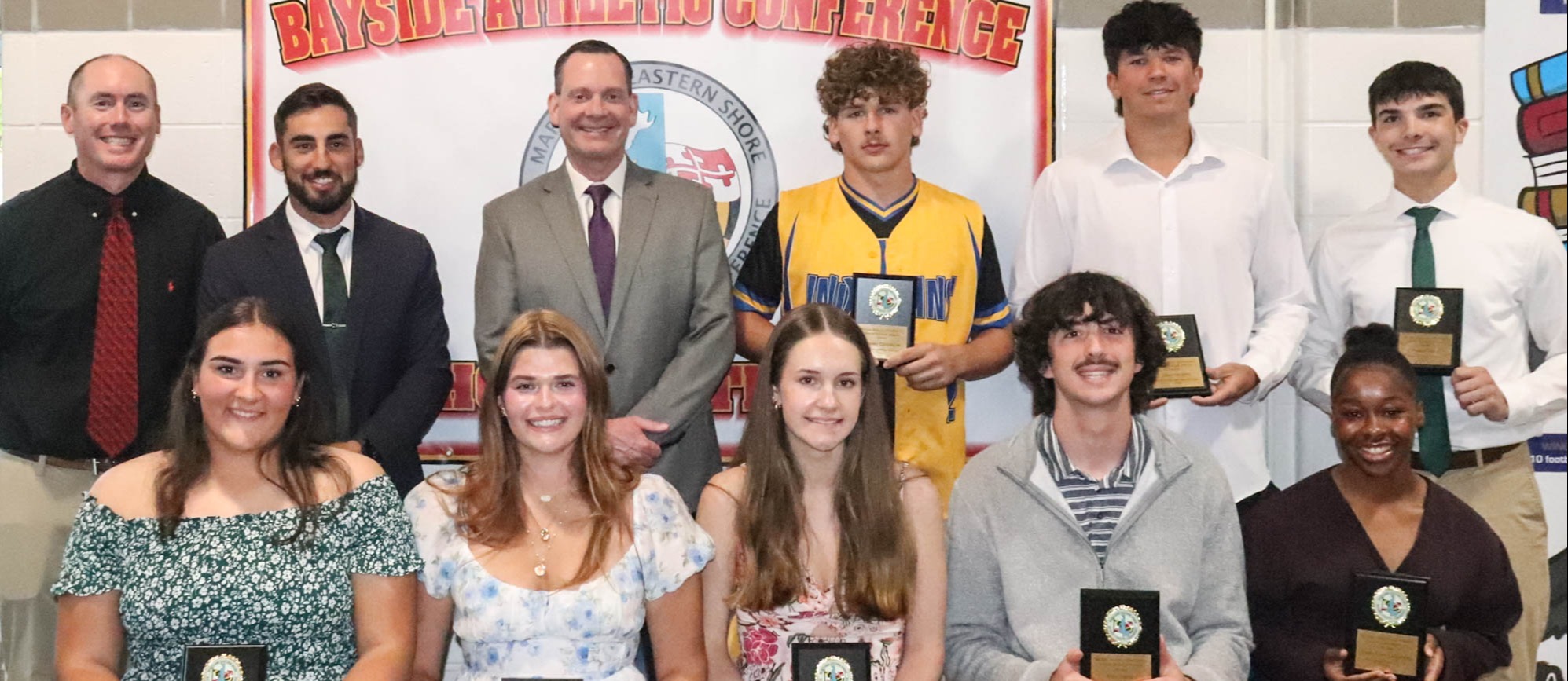 Photo of the 2026 Bayside Senior Scholar Athletes and three adults
