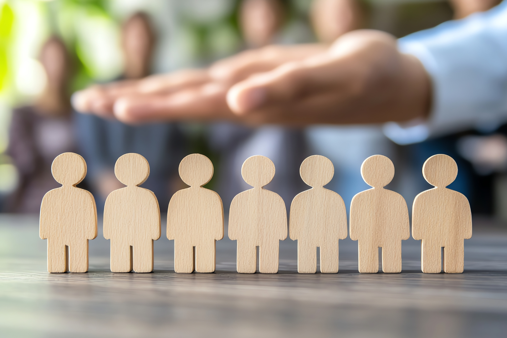 Image of wooden stick figures representing the people that work for the school system