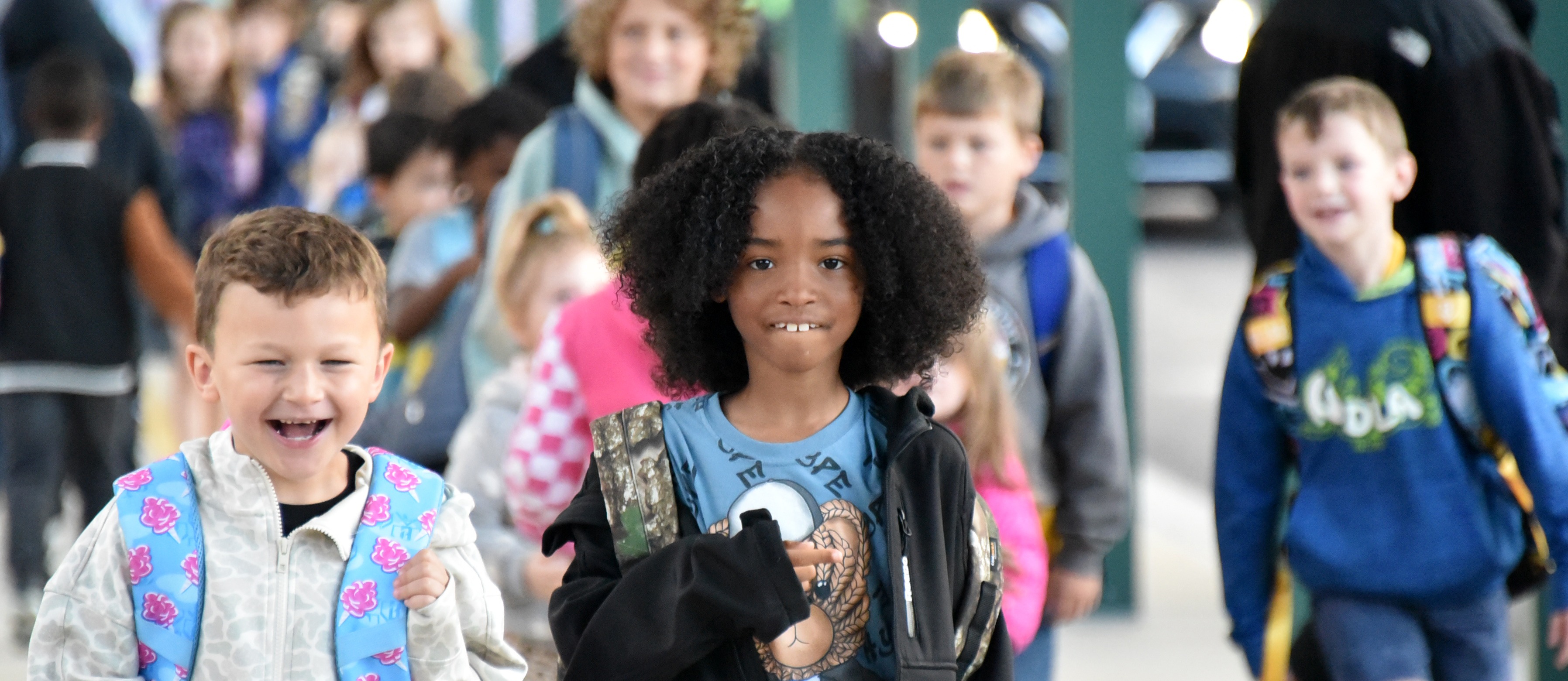 Students arrive for a day at Willards Elementary