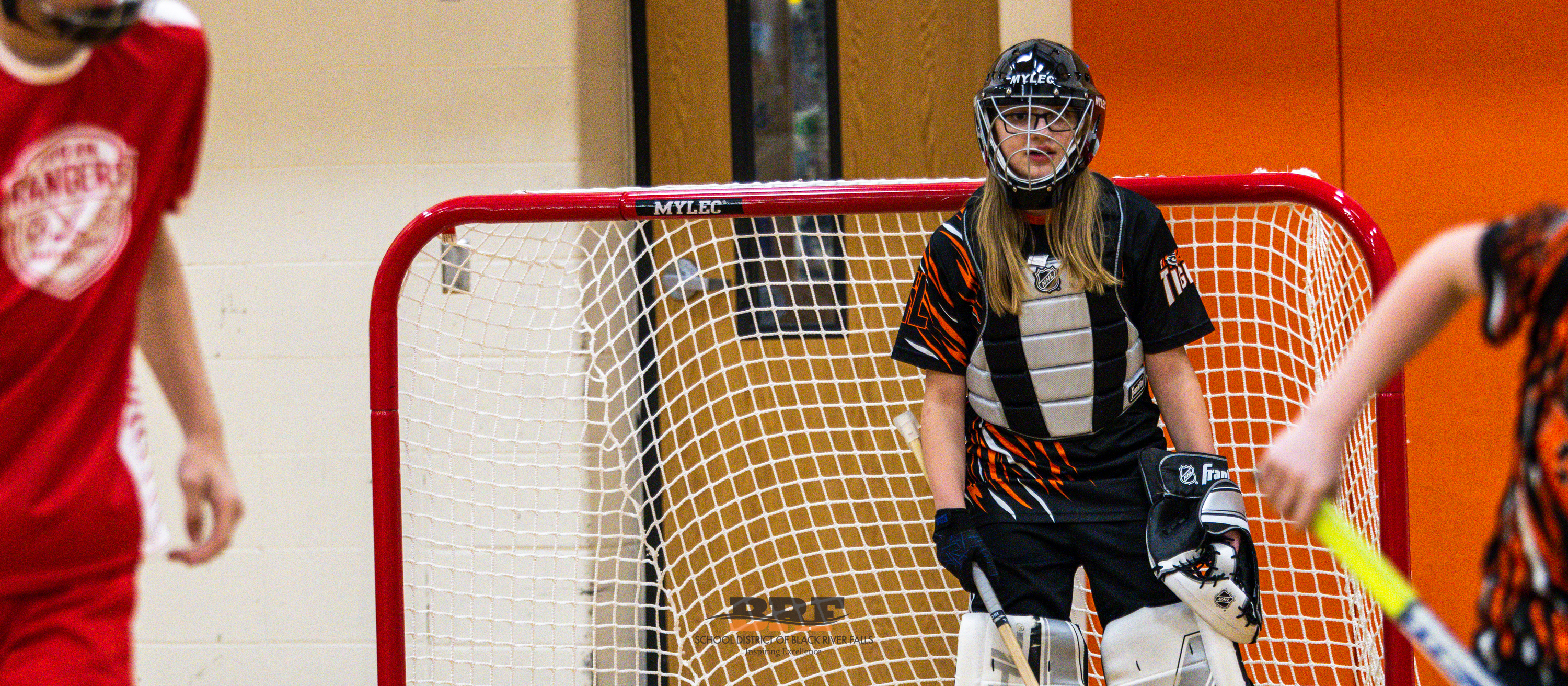 Athlete goalie stands guard at goal. 
