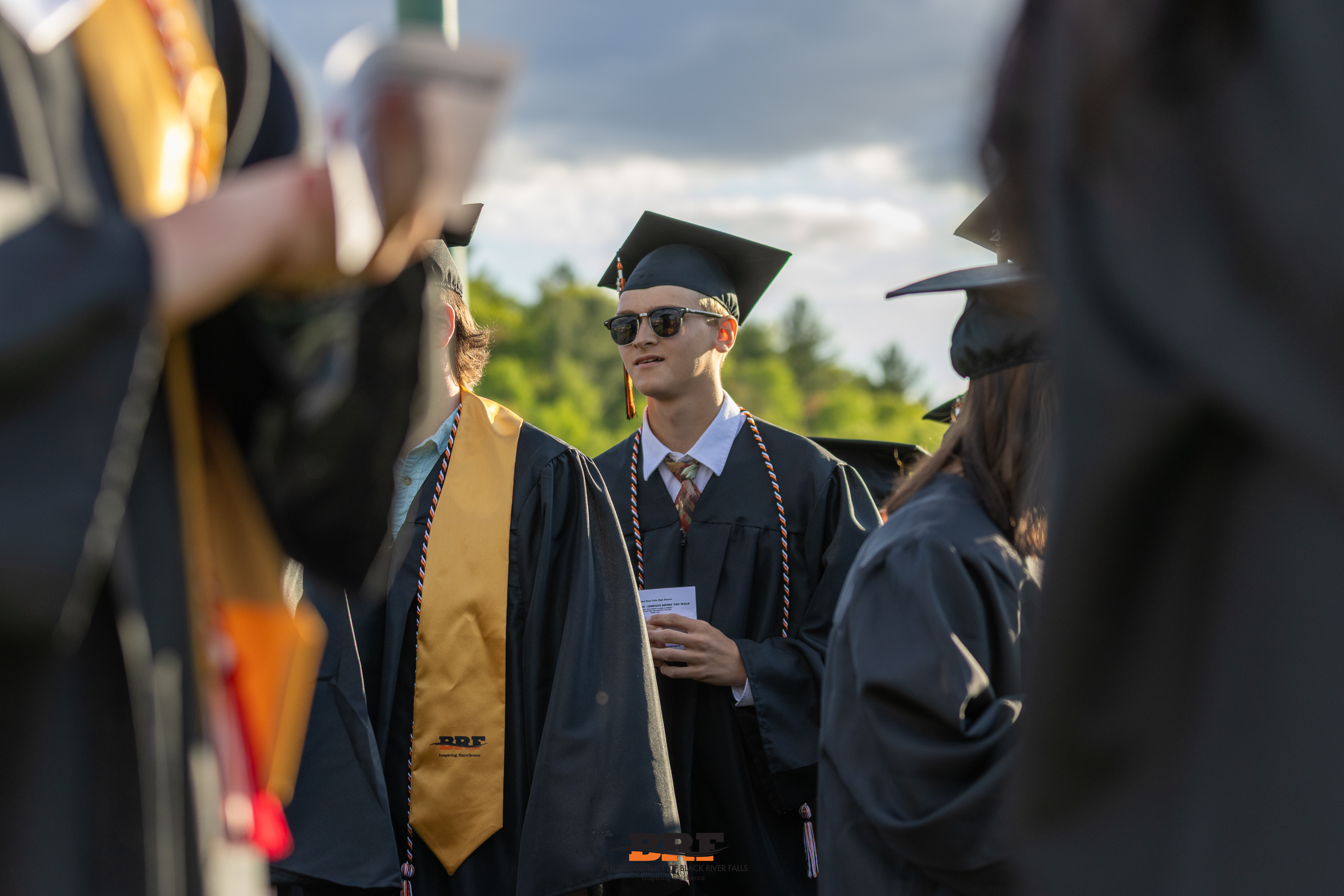 Boy stands in line during graduation