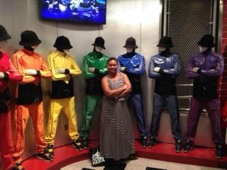 women standing in front of mannequins with arms crossed