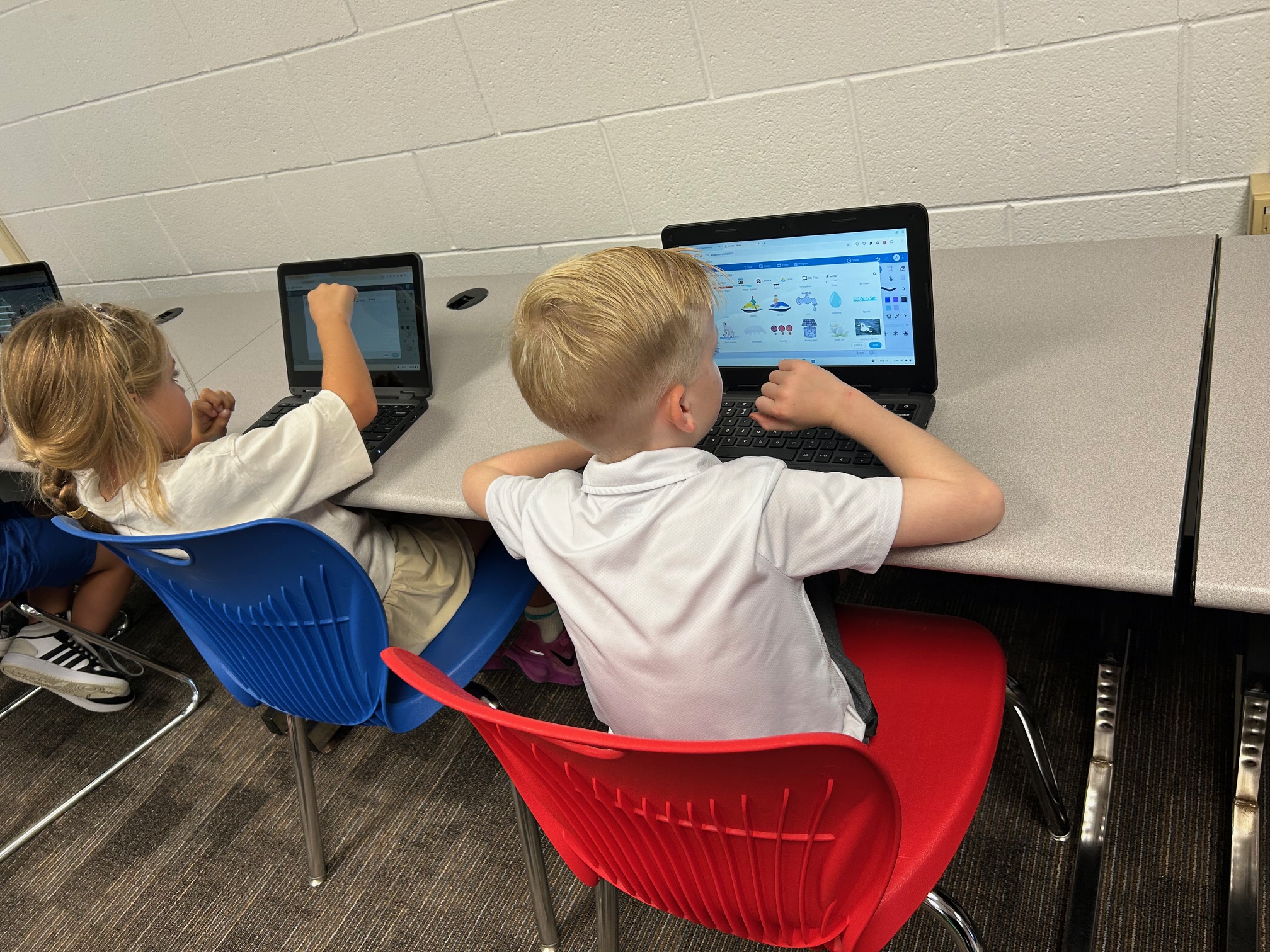 Lower grade students using technology