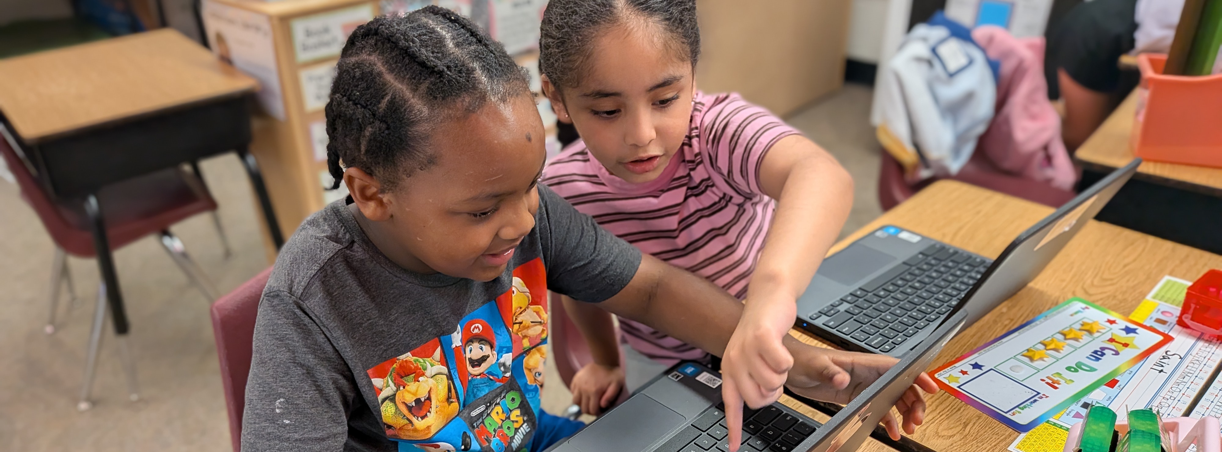 Students working together on Chromebooks