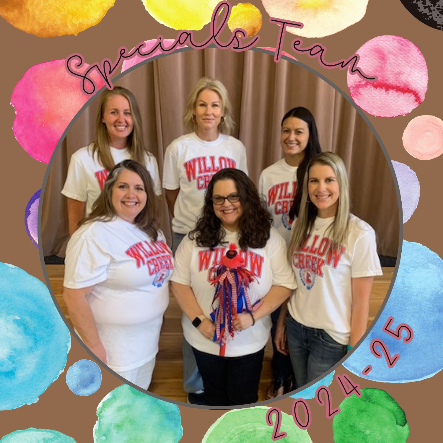 Specials Team teachers posing in school hallway in front of tree mural