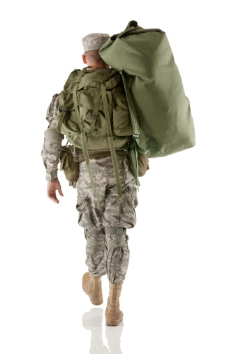 soldier carrying duffle bag