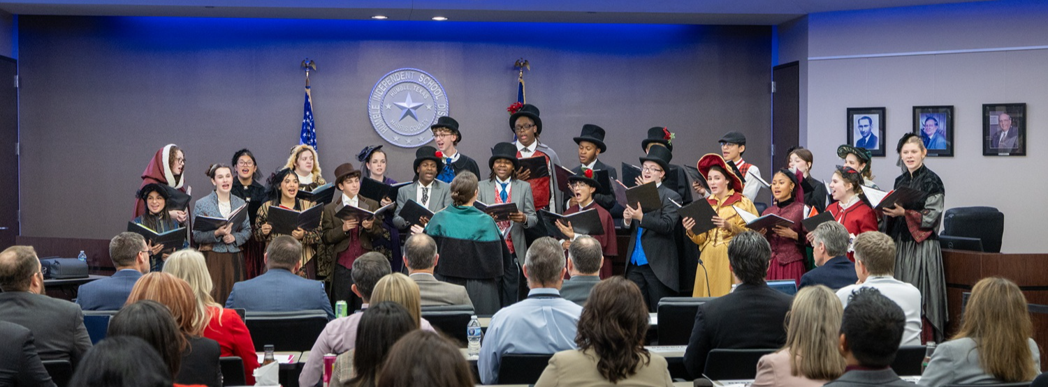 Madrigals Perform at Board Meeting