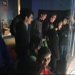 students viewing an exhibit
