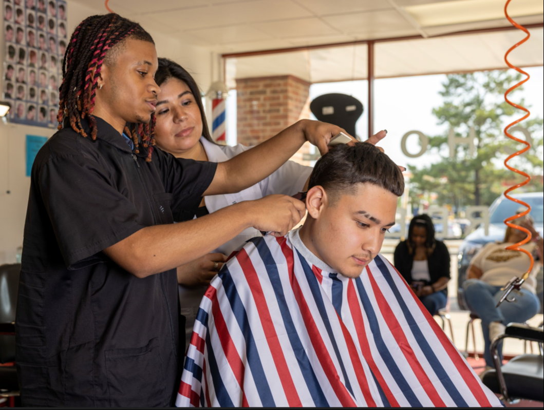 woman cutting man's hair