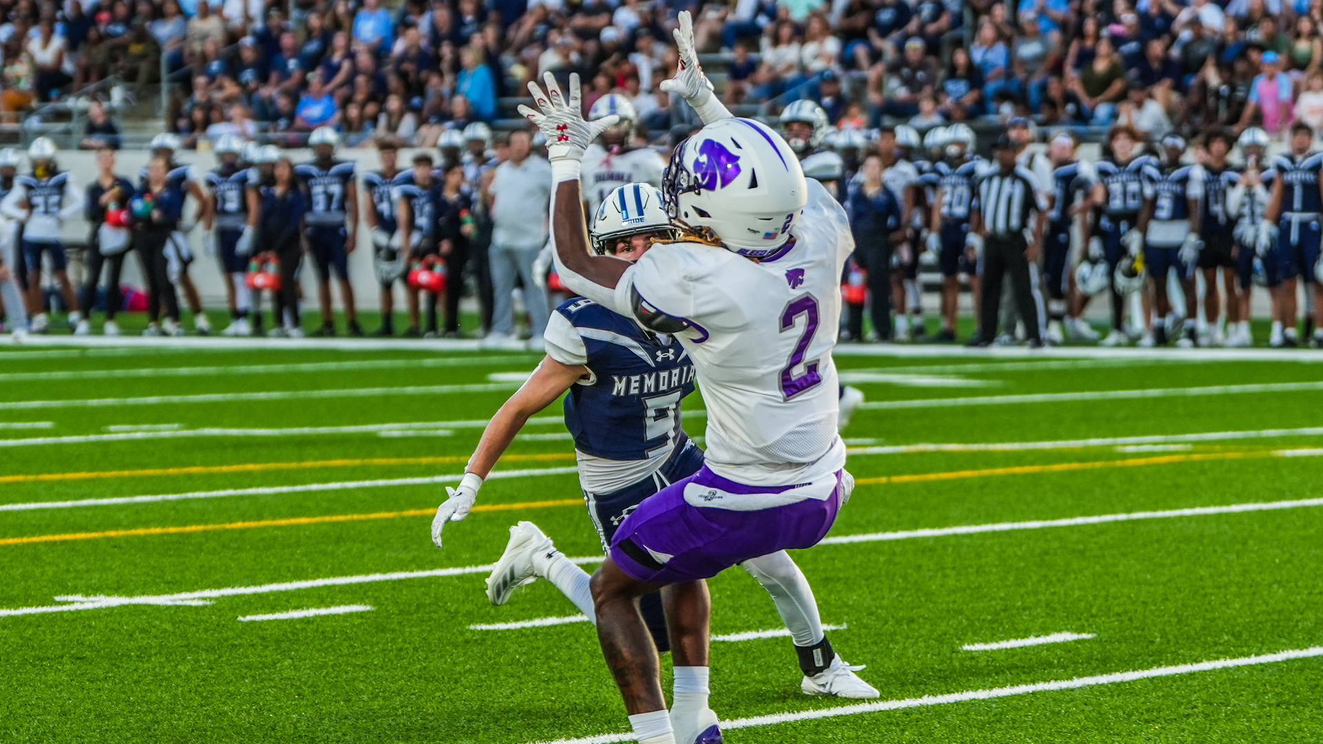 HHS football player catching a pass during a recent game.