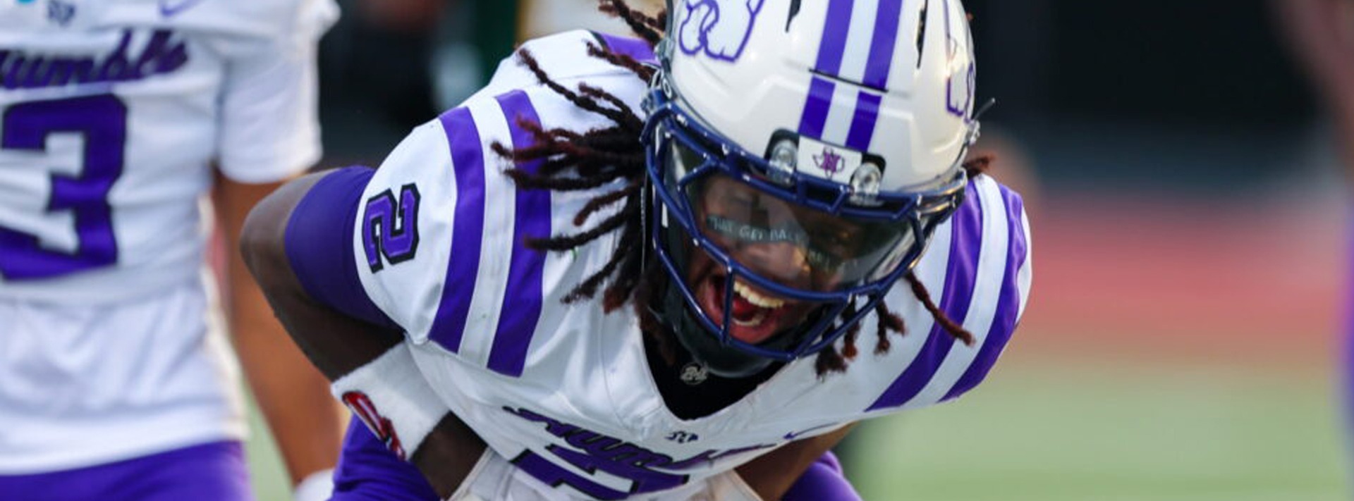 Aedyn Busby celebrating after running for a touchdown.