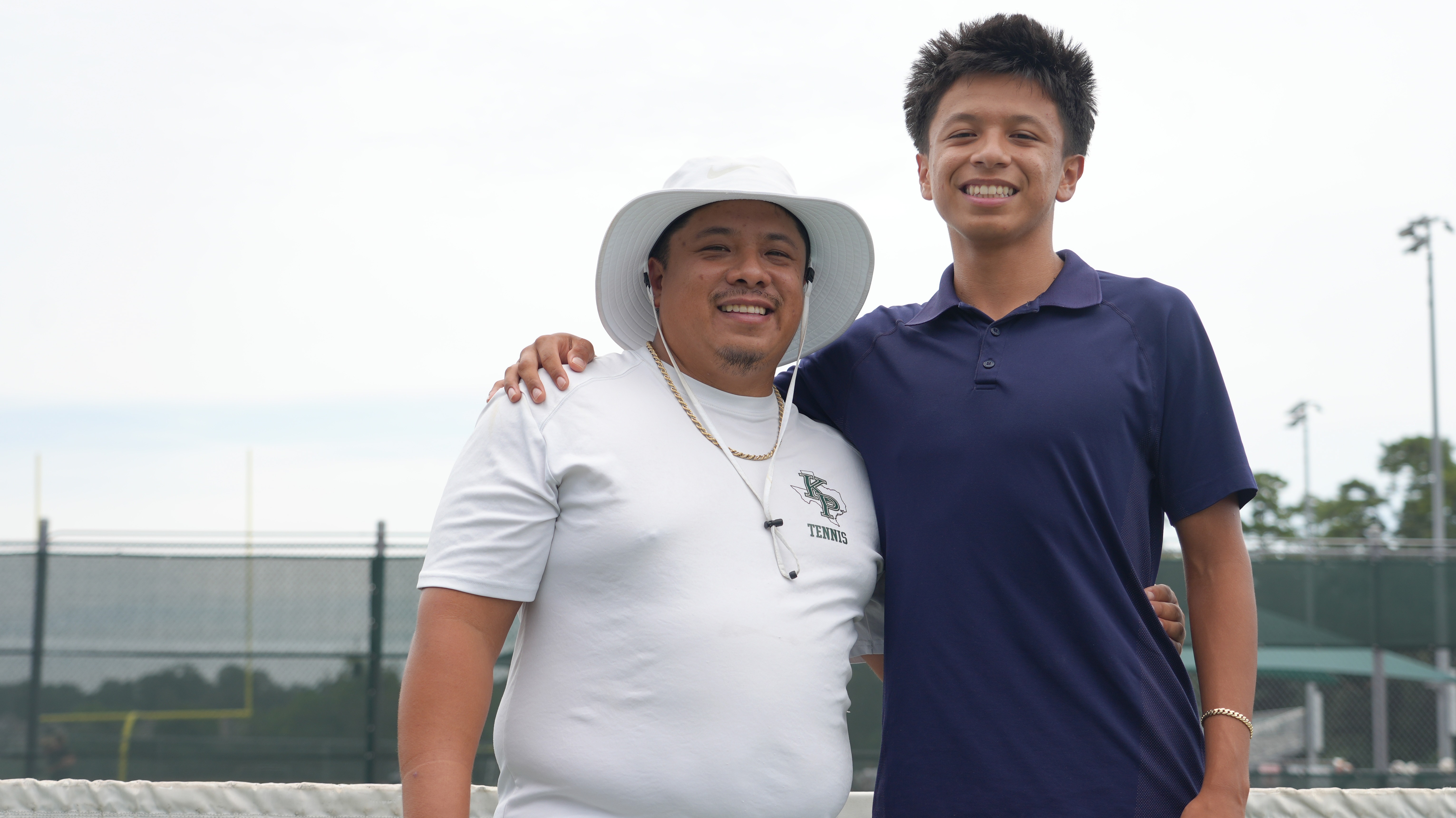 John and Jaylen Macapaz on the tennis courts