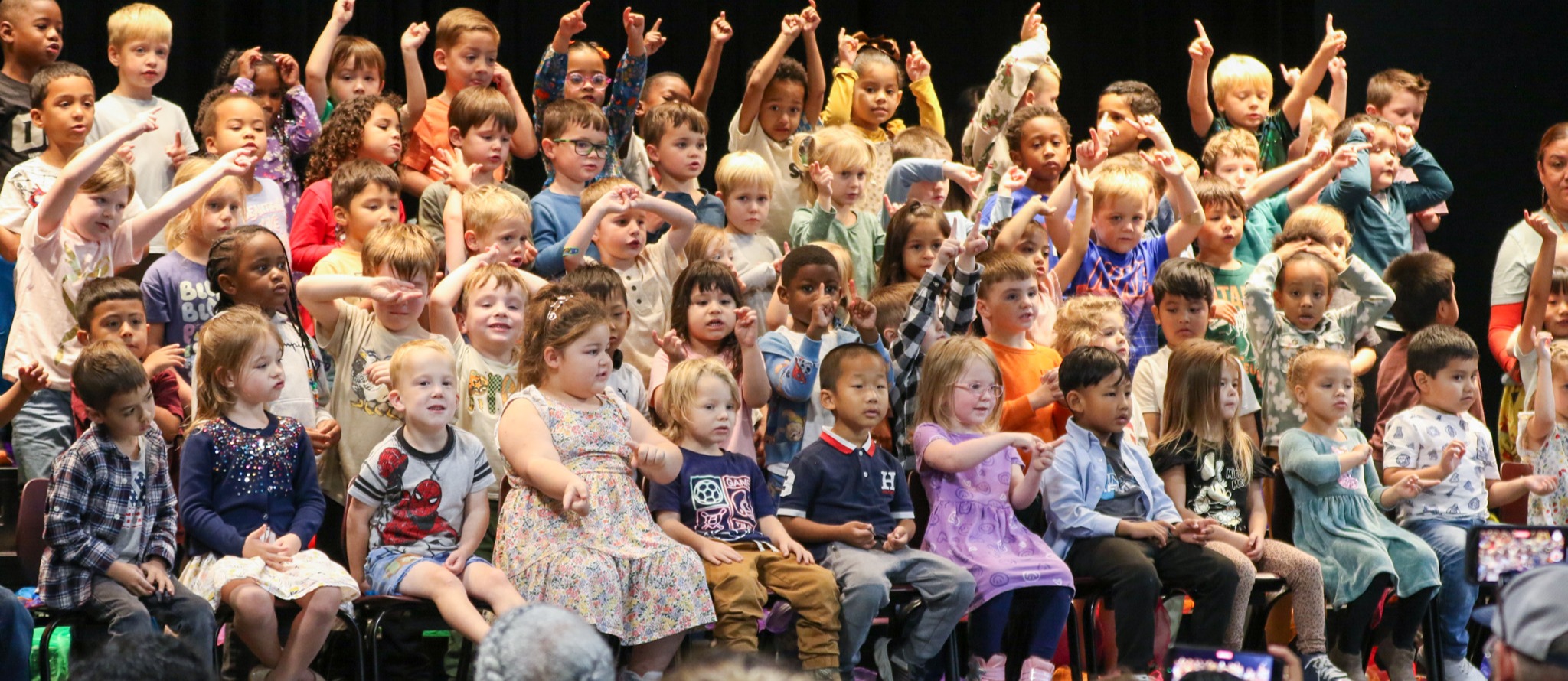 A group of Prek students performing during a musical