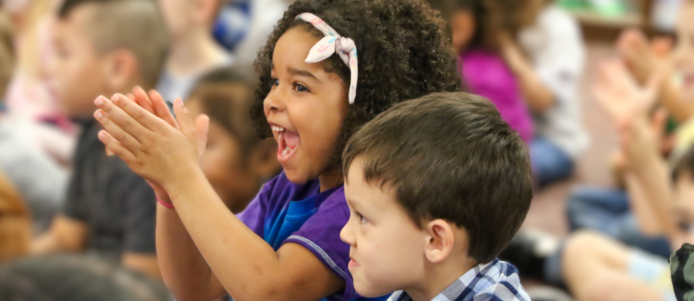 2 pre k kids smiling