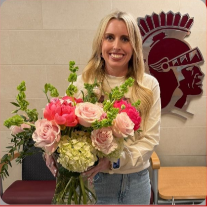 Jennifer Moore holding flowers for Teacher of the Year