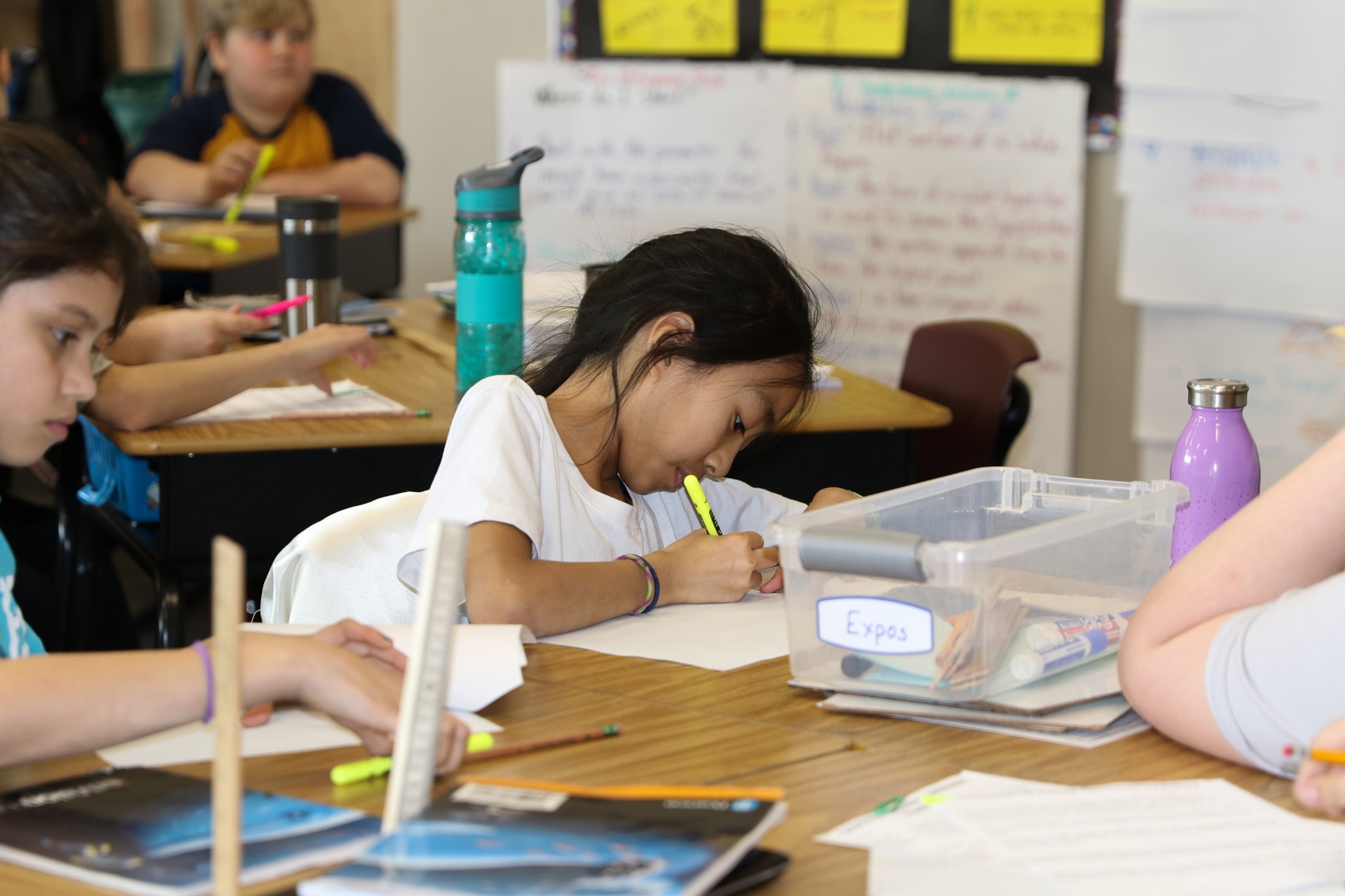 Students writing in class. 