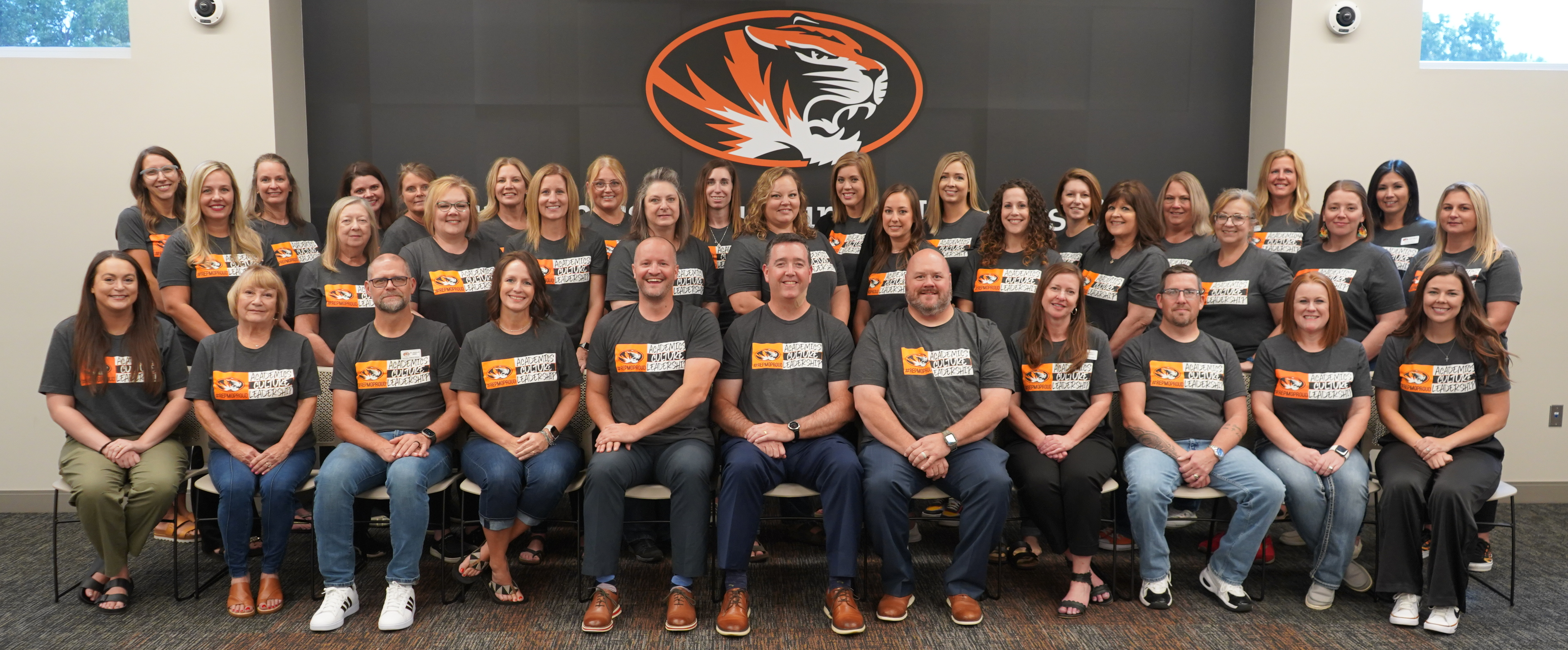 Central Office staff members standing in front of a sign that says "Republic School District"