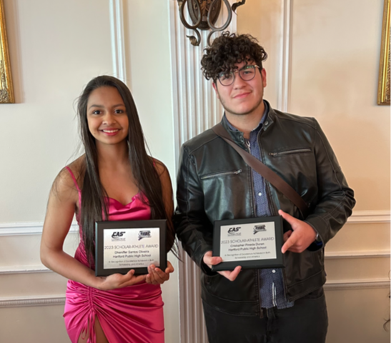 Dheniffer Santos Oliveira and Cristopher Pineda Duran holding awards