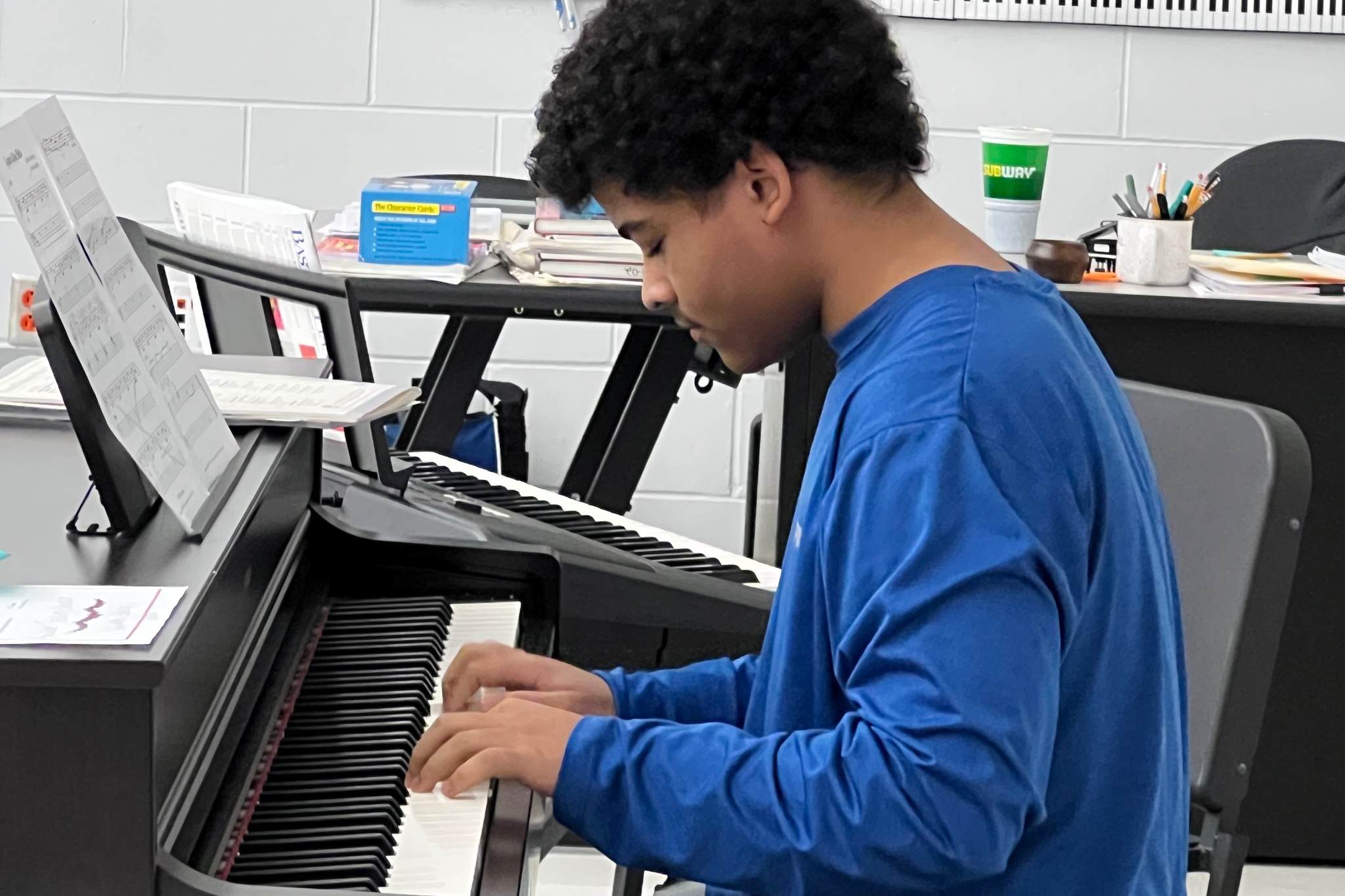 Student playing the piano