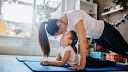 mom and daughter doing yoga