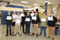 Auto students posing with their certificates
