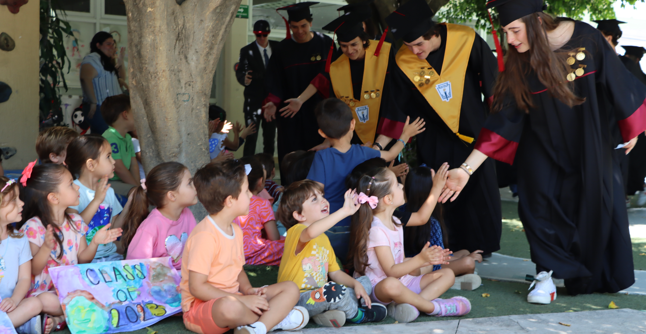 Seniors with preschool students during senior clap out