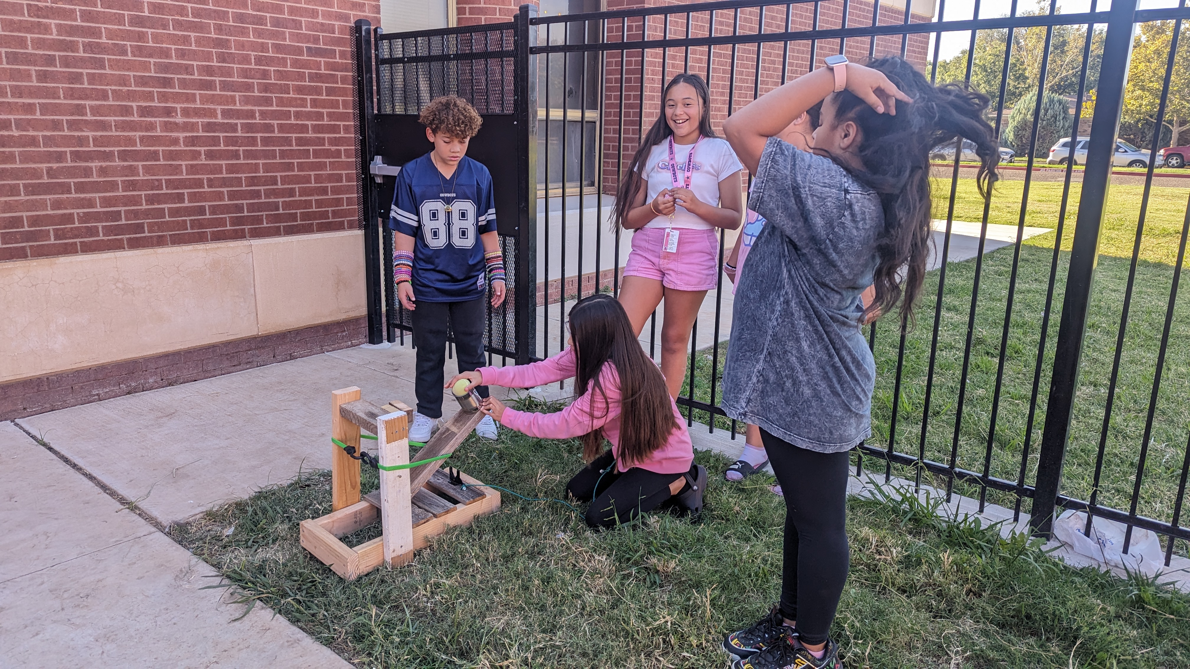 6th graders testing their catapults