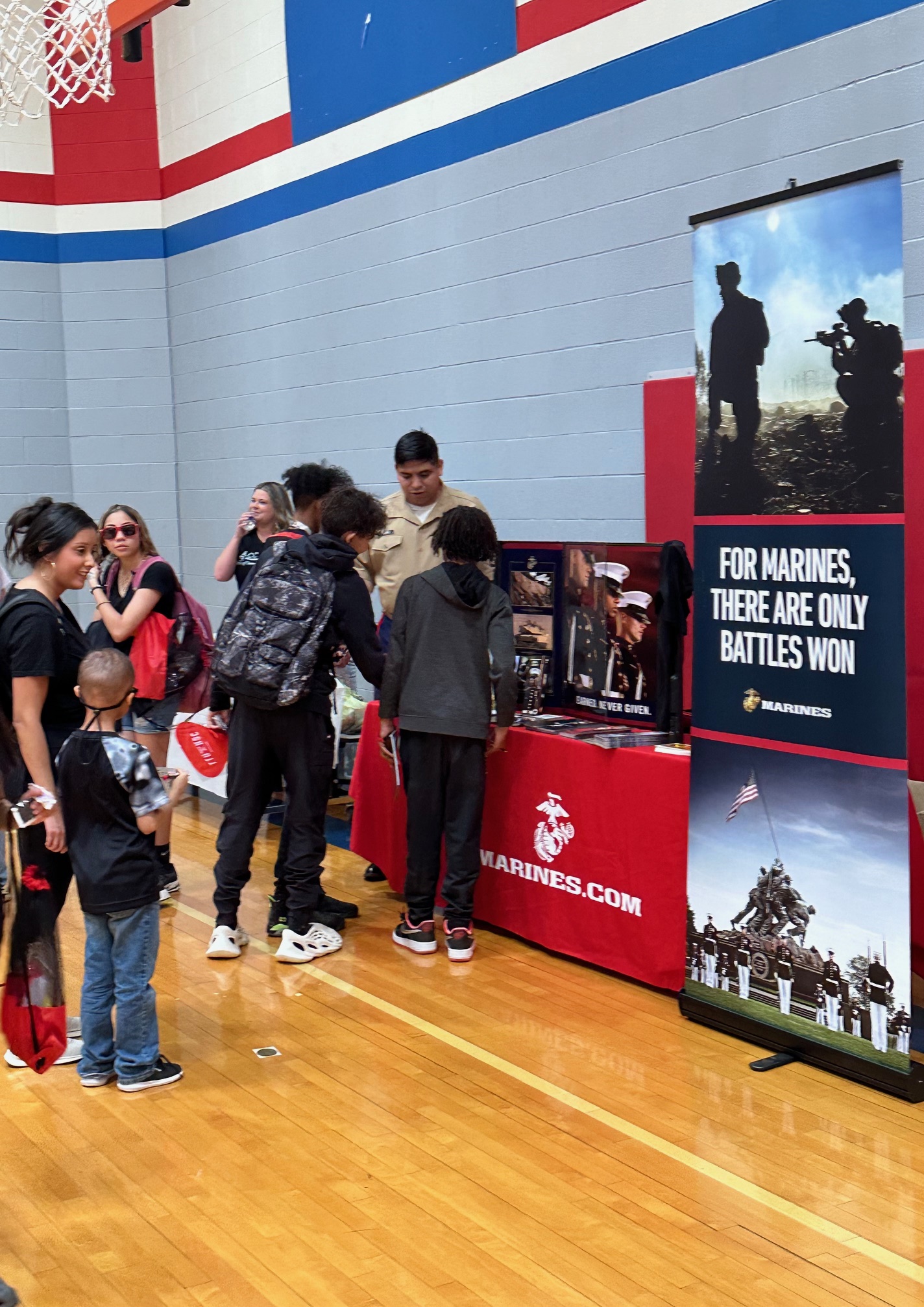 students at Marines booth