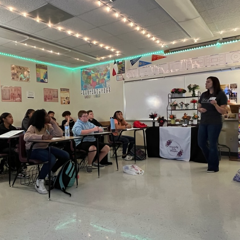 guest speaks to students about floral design