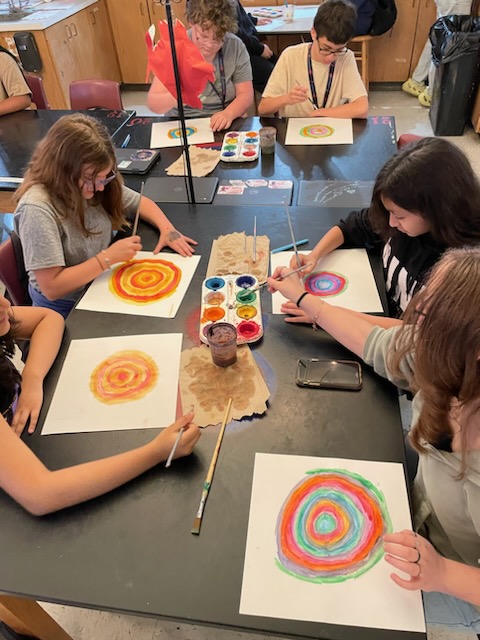 students painting