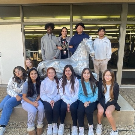 Teacher and Students posing with mustang at Coronado HS